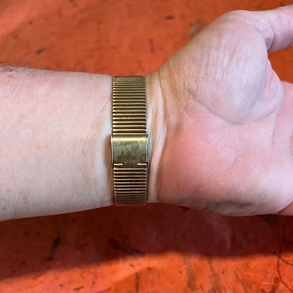VINTAGE. circa 1988 Gold-Tone Unisex Wrist Watch - Black Dial